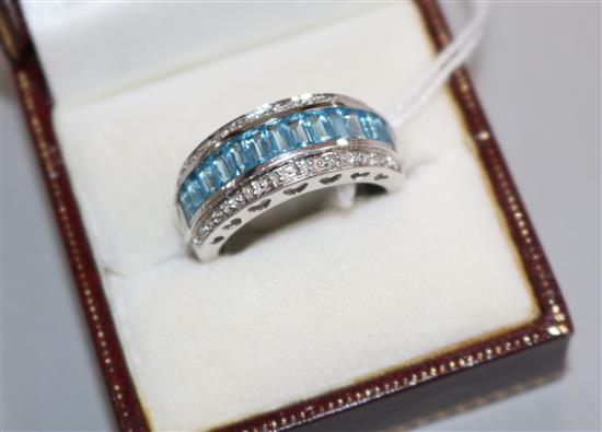 A modern 14ct white gold, aquamarine and diamond set triple row half hoop dress ring, size Q.